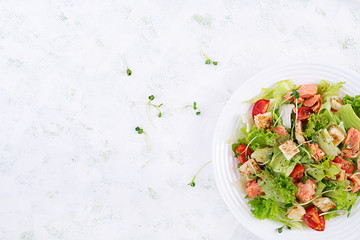 Caesar Salad with Salmon. Fish menu. Seafood - salmon. Top view, overhead, copy space