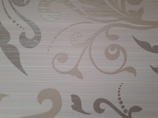 beige Wallpaper with a pattern of leaves