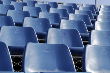 Stadium tribune. Plastic seats on the sport stadium