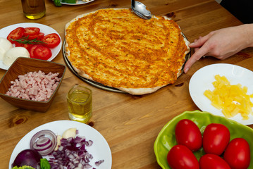 homemade pizza. ingredients, pizza base, tomato sauce. pizza in italy style