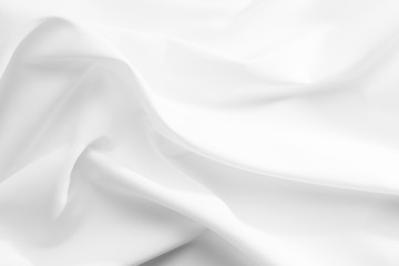 Abstract white fabric texture background. Cloth soft wave. Creases of satin, silk, and cotton.	