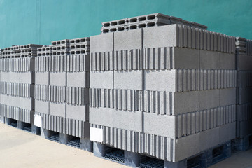 Concrete blocks on pallets before loading at warehouse.