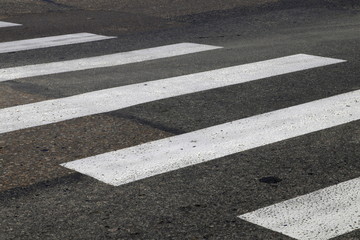 Crosswalk on the asphalt road. Zebra. Road Safety comcept