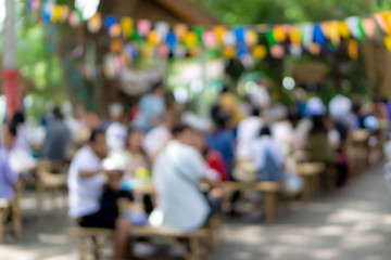Abstract Blurred image of Chiangmai street market with bokeh for background usage.