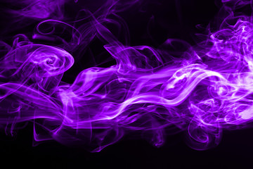 Purple smoke abstract on black background for design. ink water color
