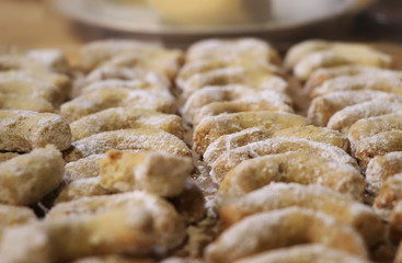 The biggest delicacy - Christmas rolls sprinkled with sugar. Small croissants for snack before christmas dinner. Also as gift for Santa Claus and Baby Jesus. Concept of have a sweeth tooth.