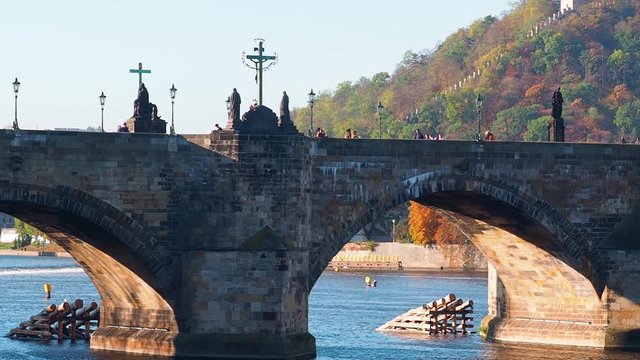 Close up of old stone bridge over Vltava River in Prague Czech Republic.