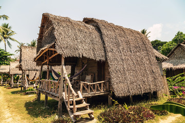 Fototapeta na wymiar Ecotourism tropical village bungalow houses resort
