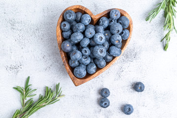 healthy eating antioxidant blueberries in a wooden bowl heart shaped