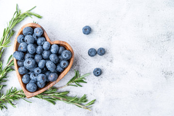 healthy eating antioxidant blueberries in a wooden bowl heart shaped