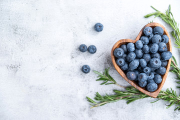 healthy eating antioxidant blueberries in a wooden bowl heart shaped