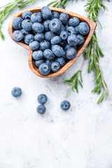 healthy eating antioxidant blueberries in a wooden bowl heart shaped