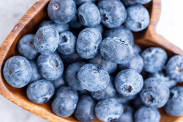 blueberry close up macro in wooden bowl