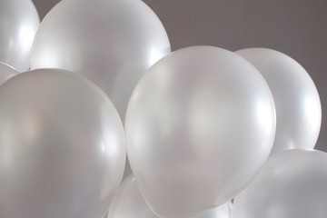 white balloons on grey beige background