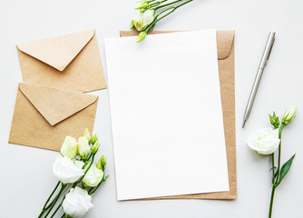 White eustoma flowers and envelopes