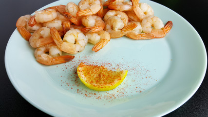 Fresh delicious boiled peeled shrimp. Cooked seafood.