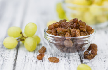 Portion of healthy Raisins (selective focus; close-up shot)