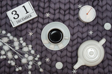 Christmas decor on a woolen blanket. A cup of hot coffee with marshmallows.Xmas card.New Year, holidays concept.