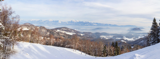 Panorama picture over medvode/ljubljana in snow from polhograjski dolomiti