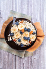 country food oatmeal with nuts and banana