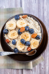 country food oatmeal with nuts and banana