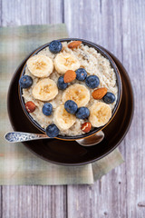 country food oatmeal with nuts and banana