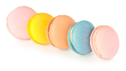 Different tasty macarons on white background