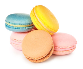 Different tasty macarons on white background