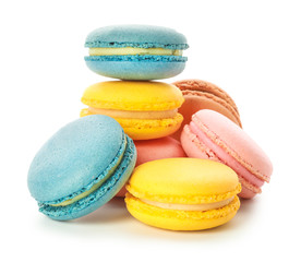 Different tasty macarons on white background