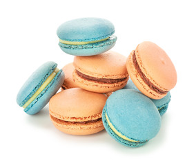 Different tasty macarons on white background