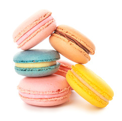 Different tasty macarons on white background