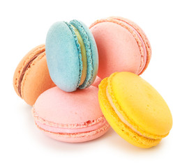 Different tasty macarons on white background