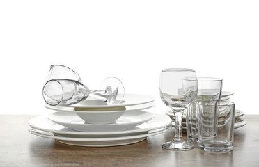 Set of clean tableware on white background