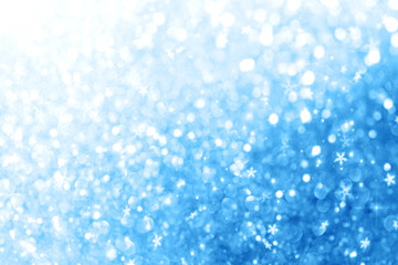 Christmas New Year colorful defocused pastel background with snowflakes and blinking stars.