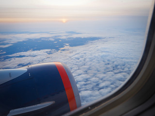 Naklejka na ściany i meble The view through the beautiful plane window