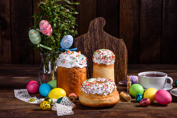 Easter cake and colorful eggs on a dark background