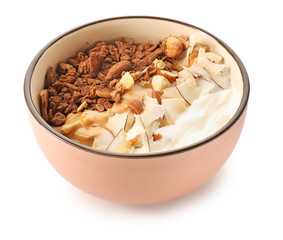 Tasty granola with yogurt in bowl on white background