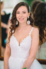 Fototapeta premium Wedding day. Portrait of beautiful bride with bouquet