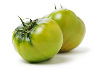 fresh green tomato isolated on white background