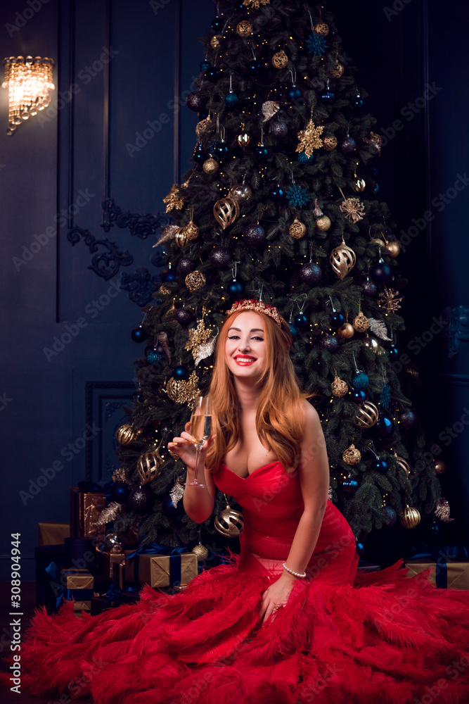 Wall mural christmas party scene, woman in gorgeous red feather dress, fashionable concept