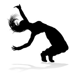 A woman street dance hip hop dancer in silhouette