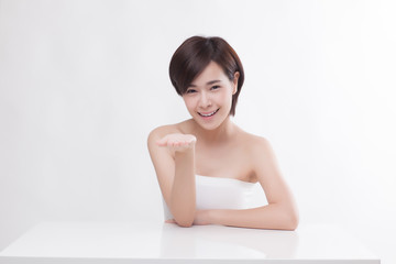 Young beautiful Asian female model on the white background
