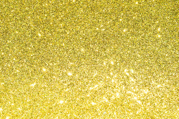 sparkles of golden glitter texture background