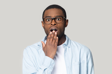 Surprised young african american man looking at camera.