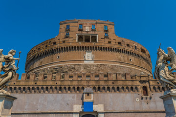 Fototapeta na wymiar Sant'Angelo Castle facade with two angels in Rome, Italy