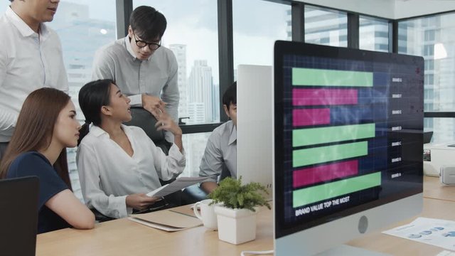 4K UHD Slow motion : Group of business asian or officer working, meeting, discussion and brainstorming with computer in meeting conference room at modern office in downtown city. Brainstorm concept
