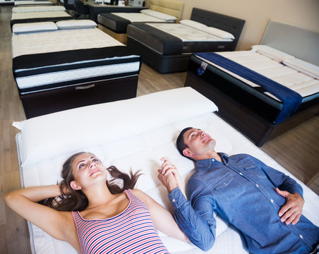 Couple choosing mattress