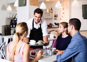 Waiter showing hospitality and serving visitors