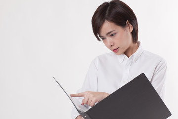 Young beautiful Asian female model on the white background for business concept