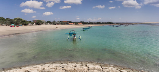 Panorama of the turquoise water in the bay of Kuta, Indonesia